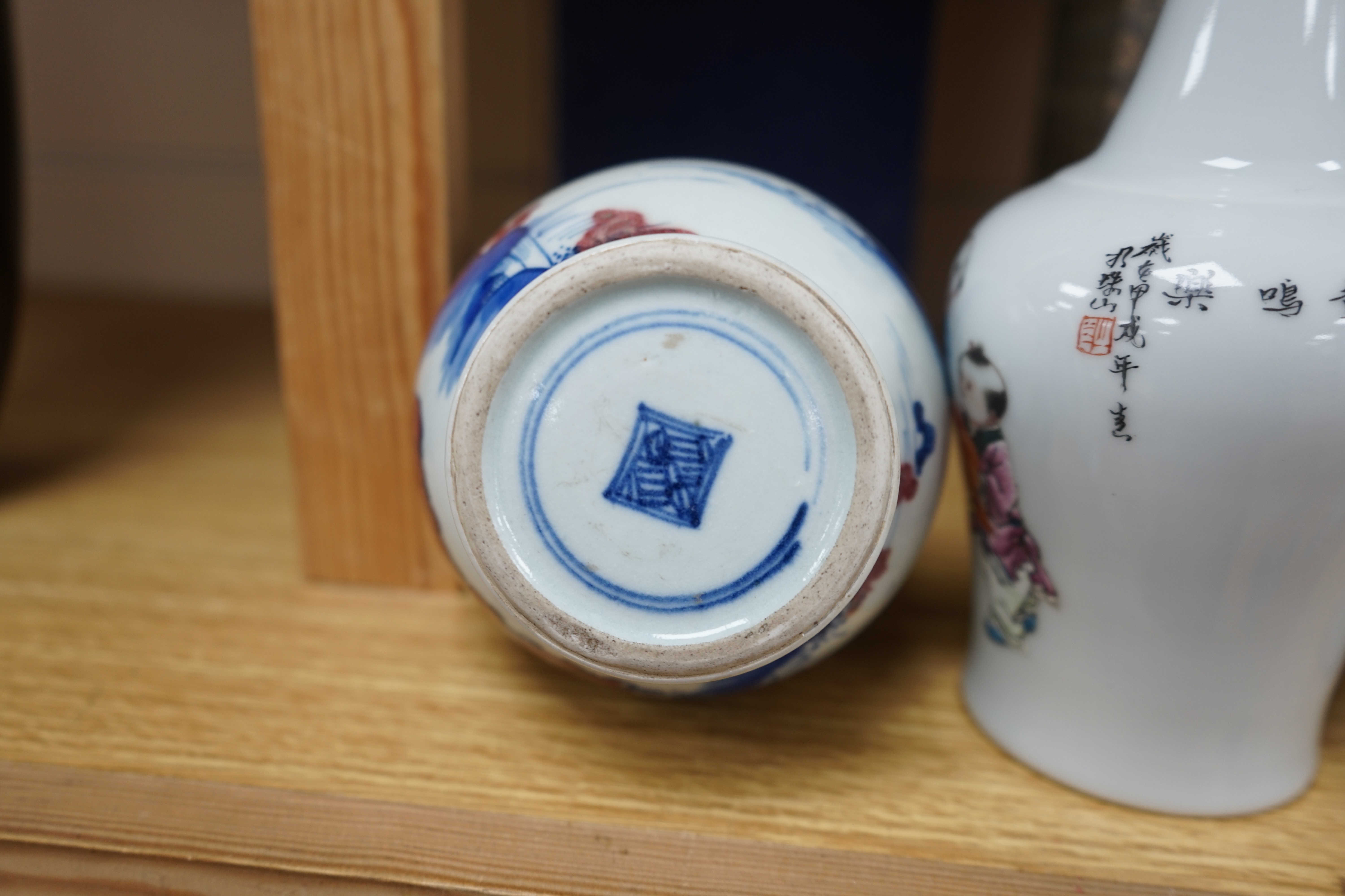 Two Chinese enamelled porcelain figure decorated vases, an underglaze blue and copper read garlic neck vase, and a rectangular jar with wood stand Condition - One vase cracked and chipped the rectangular jar lacking cove